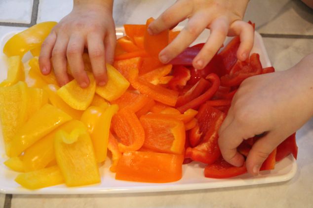 little hands taking pepper pieces