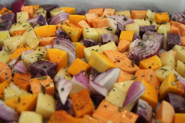 vegetables with sprinkled spices on tray