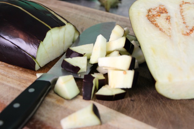 cutting eggplants into cubes