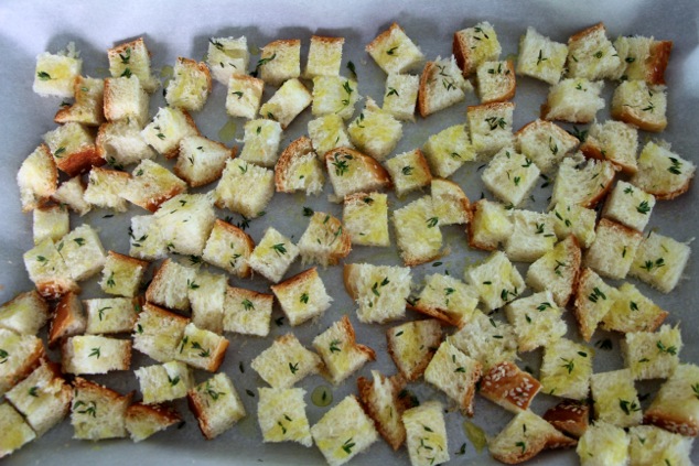challah cubes with thyme on tray