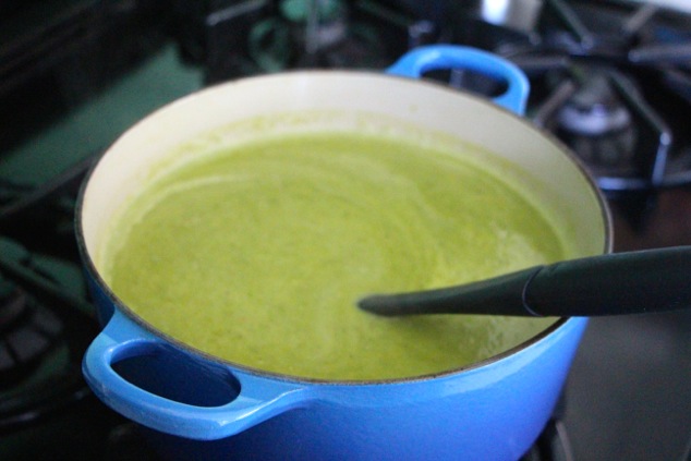 mixing cream into pea soup