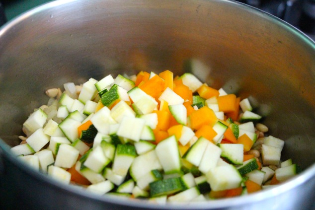 adding cubed veggies to pot