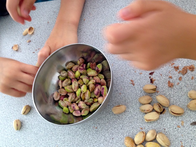 kids peeling pistachios