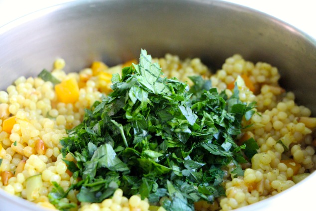 adding chopped parsley to pot