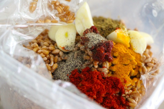 adding spices and garlic to cooking bag