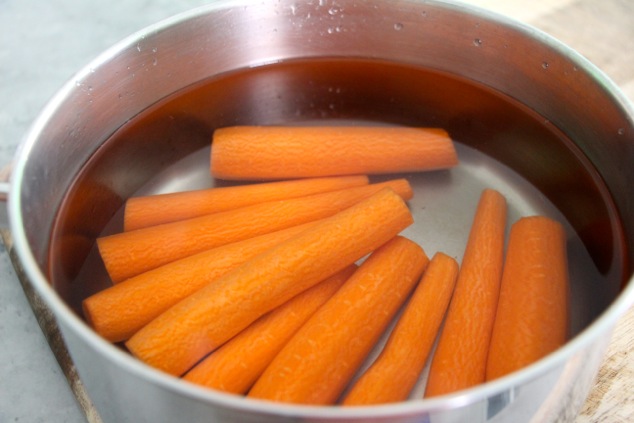 carrots with water in a pot