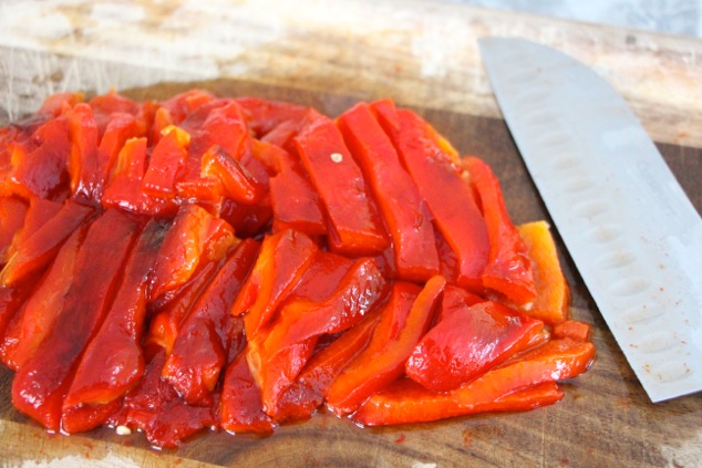 cutting roasted peppers
