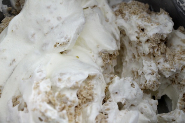 folding Halva pieces into cream