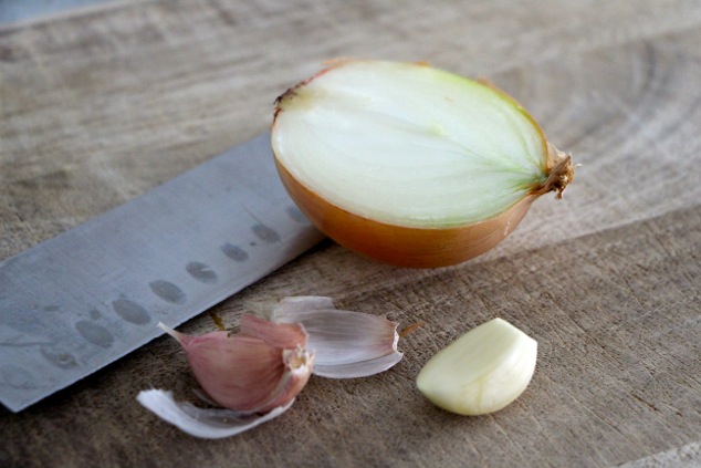 half an onion and garlic cloves