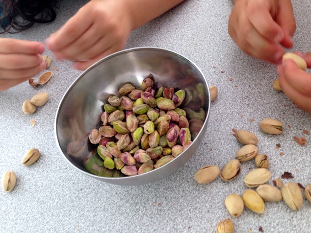 kids peeling pistachios