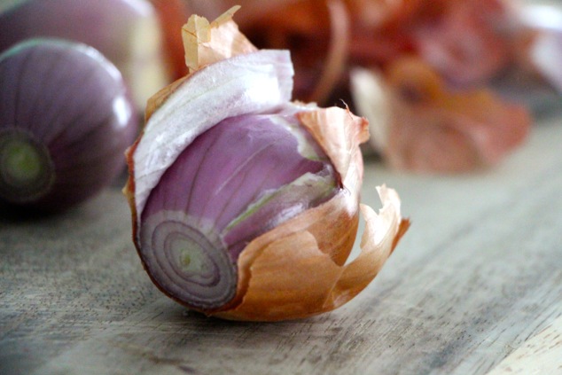 peeling shallot up close