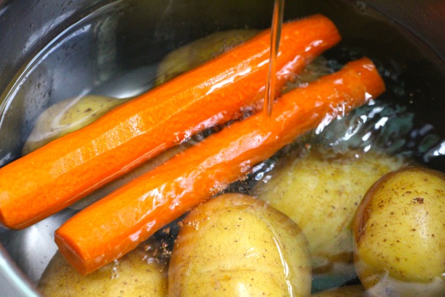 potatoes carrots and water in pot