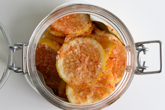 arranging lemon slices in a jar