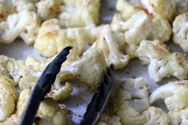 cauliflower florets and tongs