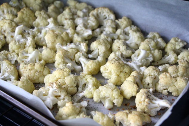 cauliflower florets on tray to oven