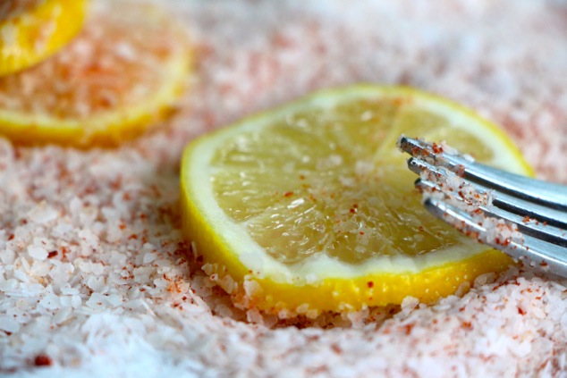 coating a lemon slice up close