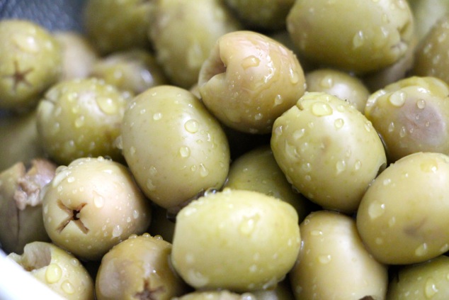 washing green olives up close