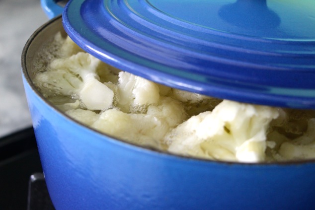 a peek at cauliflower boiling in a pot