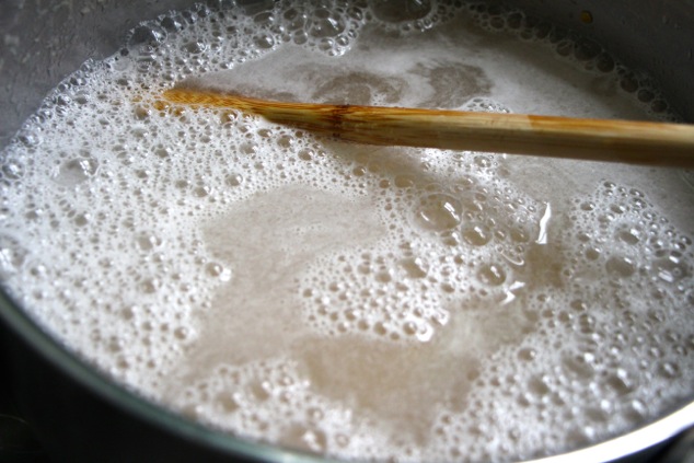 adding water to chickpeas in pot