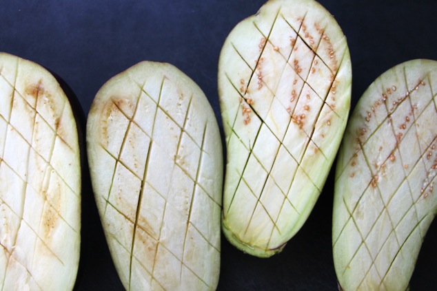 eggplants cut into checherboard slits