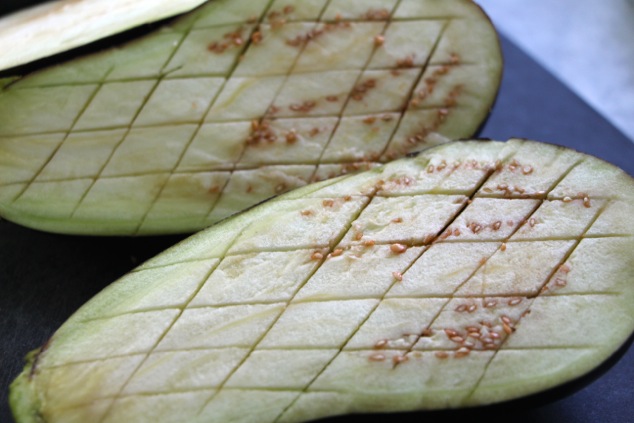 eggplants slit into checkerboard up close