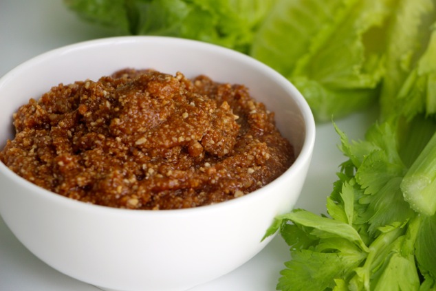 Charoset in a bowl with greens background