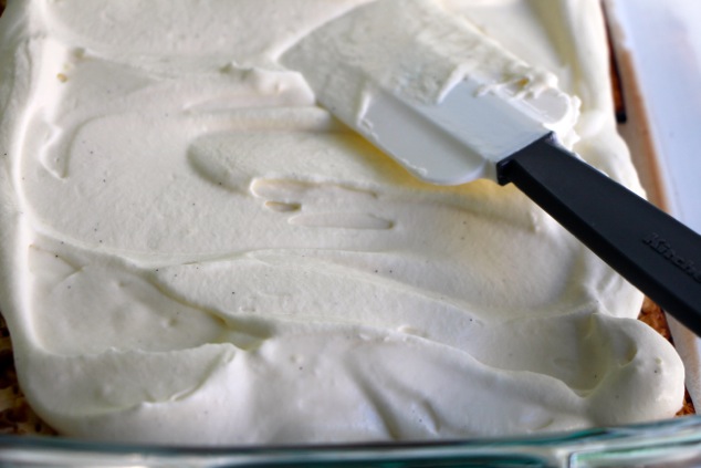 spreading cream with spatula up close
