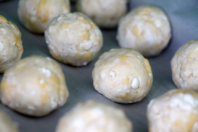 cheese dough balls on tray up close