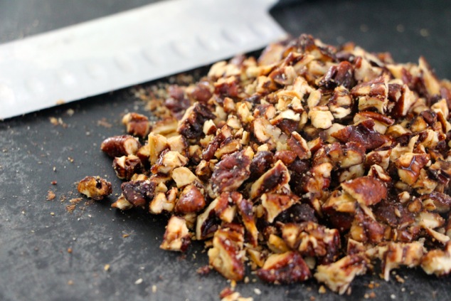 chopping caramelized pecans