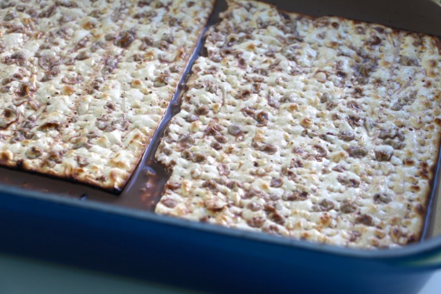 dipping matzah in cocoa mixture