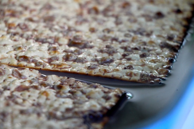 dipping matzah up close