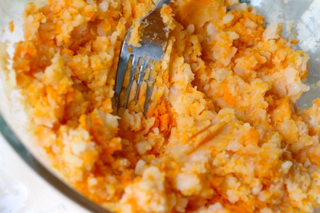 mashing potatoes with a fork