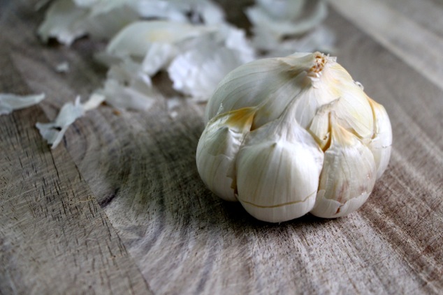 peeling a head of garlic