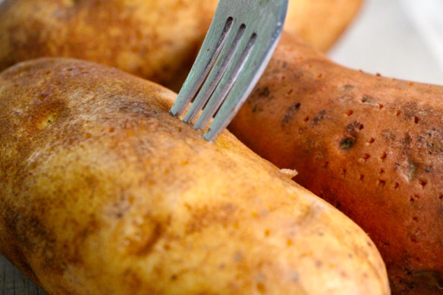 piercing potato with a fork