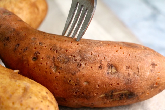 piercing sweet potato with fork