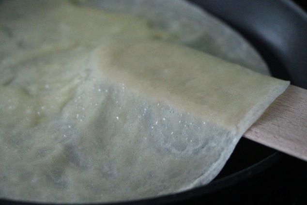 cooking crepe in pan