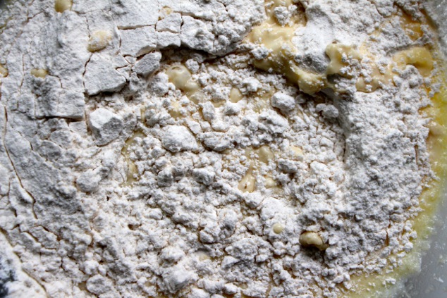 adding flour into batter