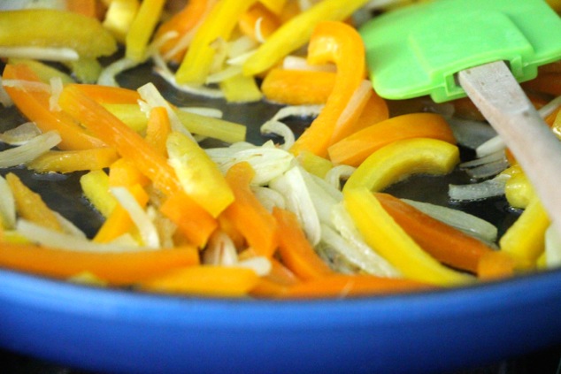 adding sliced garlic and mixing