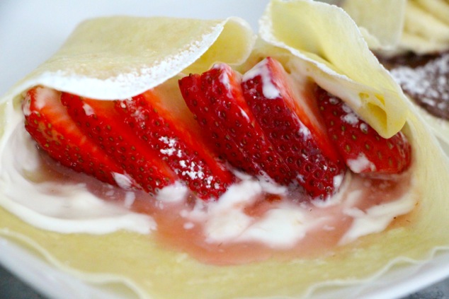 folding strawberry cream crepe up close