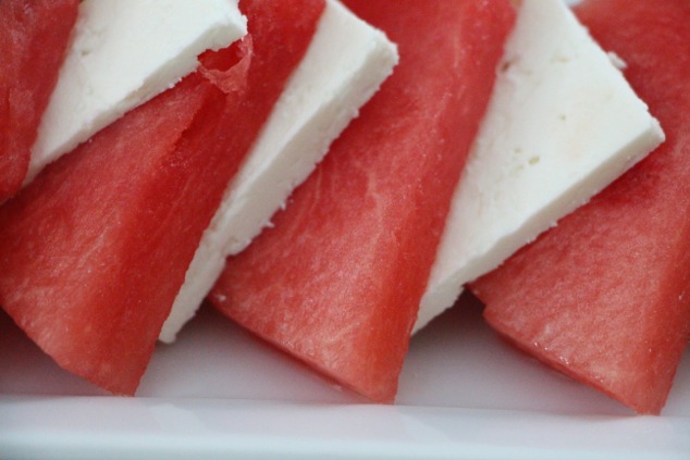 arranging watermelon feta slices