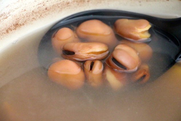 fava beans ready in the pot up close