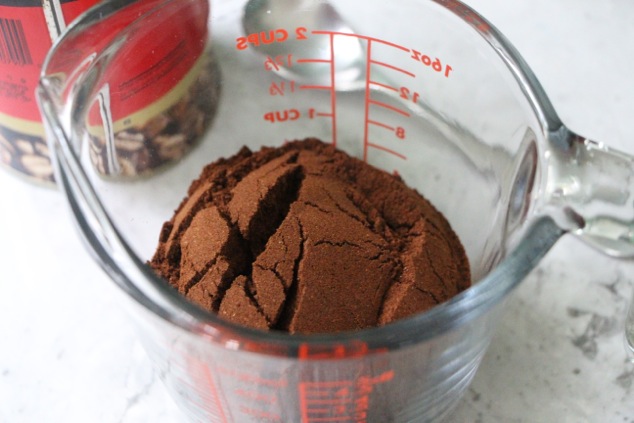 ground turkish coffee in measuring cup