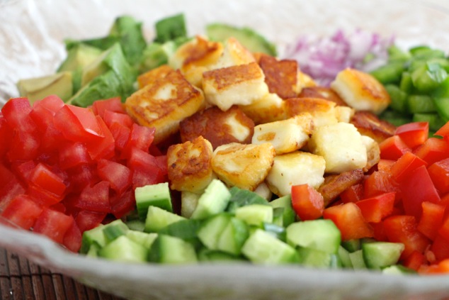halloumi cubes in salad bowl from side