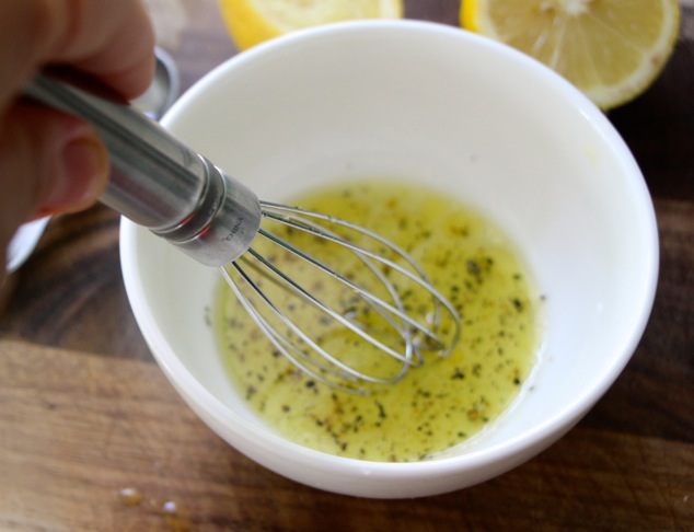 mixing dressing salad