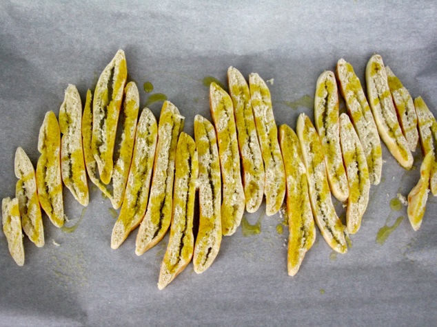 pita sticks on tray with olive oil