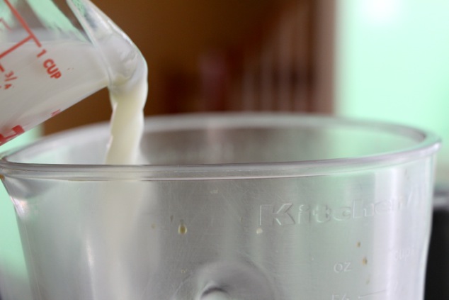 pouring milk to blender