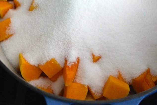 pumpkin cubes and sugar in pot