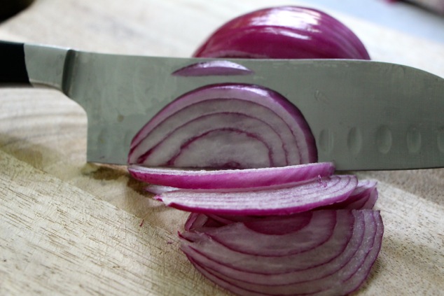 slicing purple onion
