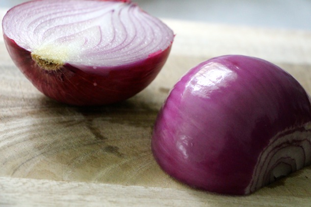 purple onion on cutting board