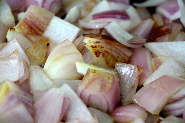 purple onion sautéing up close